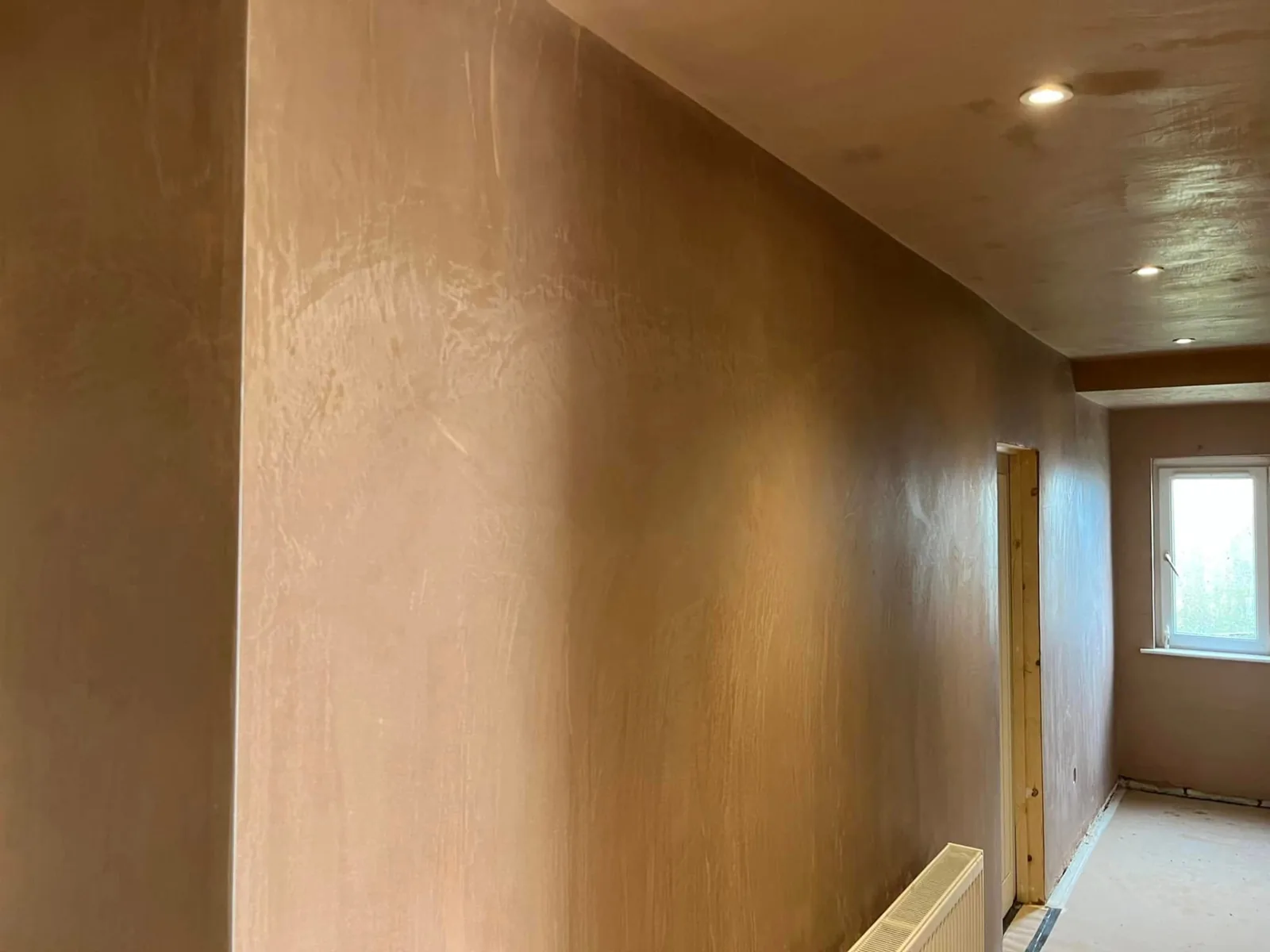 Smooth newly plastered interior walls and ceiling