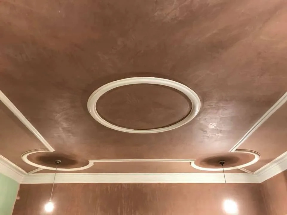 Decorative plaster ceiling with detailed circular mouldings